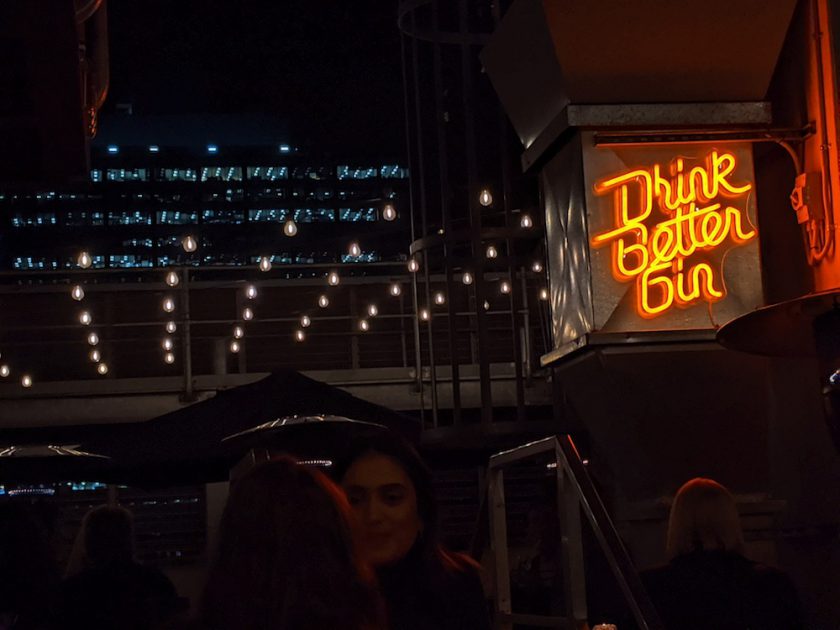 Drink Better Gin sign at Secret Garden Bar at QT