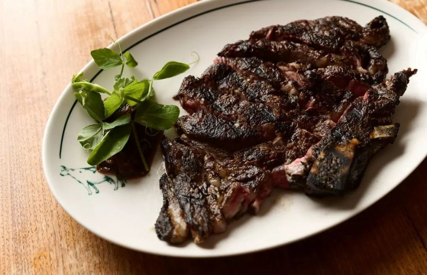 Well done steak presented on white plate at Kingsleys Woolloomoolloo