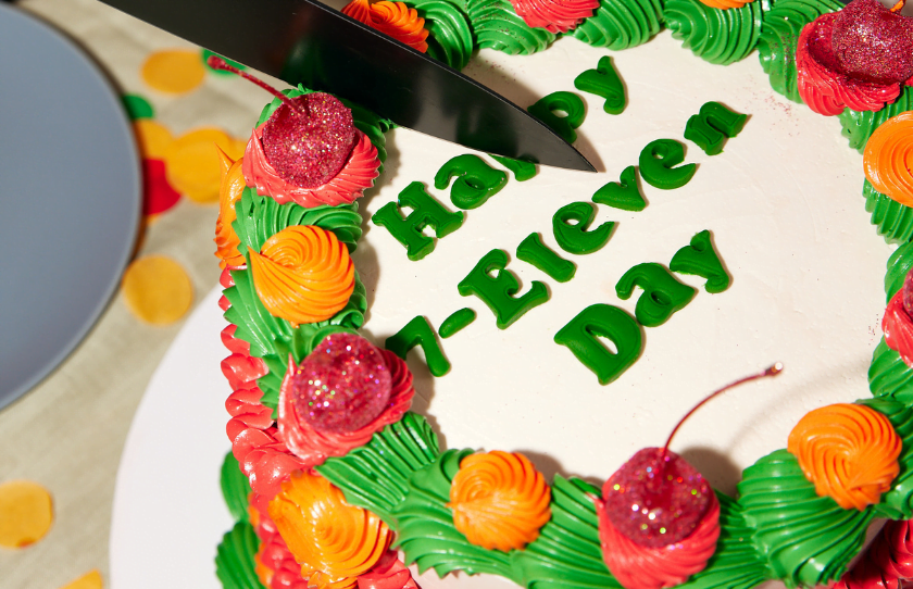 Birthday cake that says 'Happy 7-Eleven Day'.