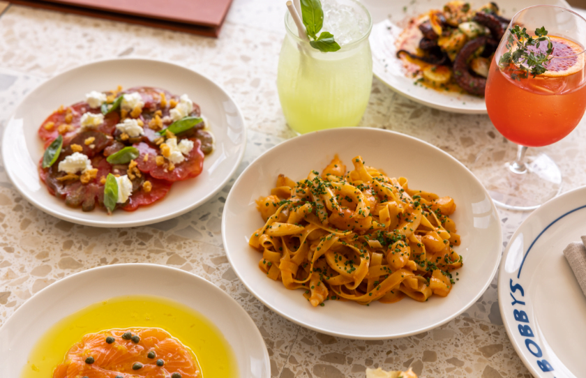 Selection of share plate menu items at Bobby's Cronulla including ox heart tomato and pasta.