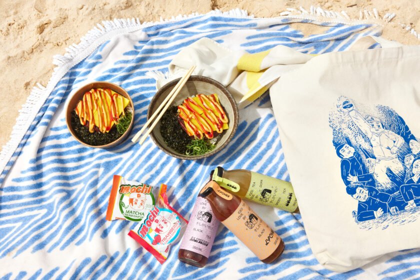 DOPA donburi's on picnic blanket at Bondi.