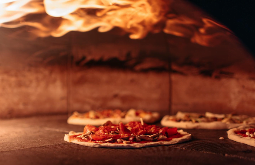 Pizza in food wire oven at Salt Meats Cheese Sydney