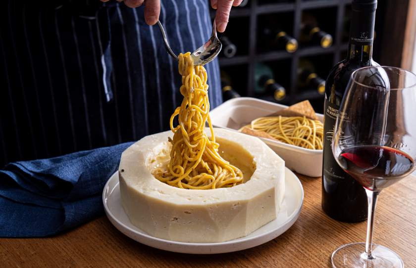 Cacio e pepe in cheese wheel for Valentine's Day at I Maccheroni.