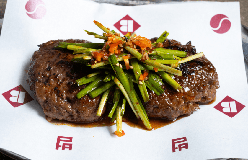 Korean dish on top of branded paper