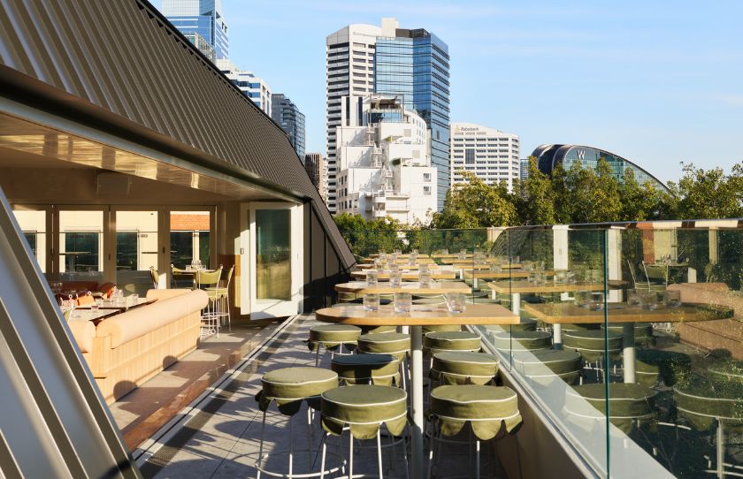 A cosy rooftop with a view of Sydney CBD and the new W hotel on a sunny day - The Bristol Reopening Sydney