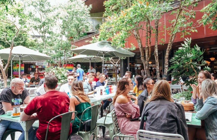 The people sitting outside enjoying their time