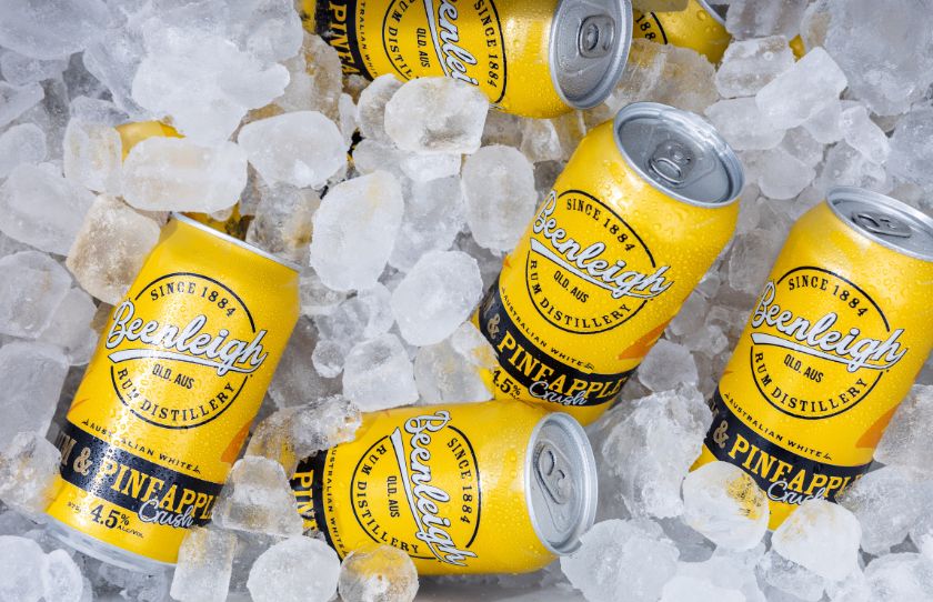 August Drinks Guide - Image of Beenleigh Pineapple and rum cans on ice