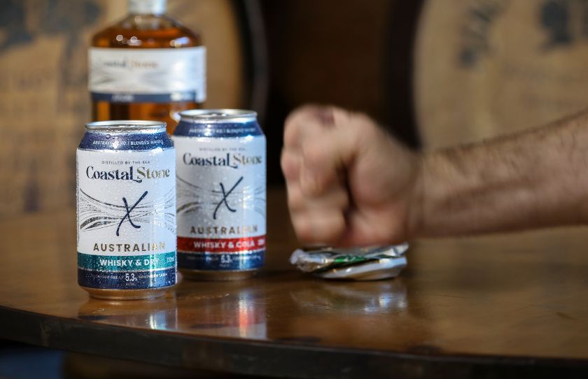 Best August Drinks - RTD Coastal Stone Cans in front of bottle