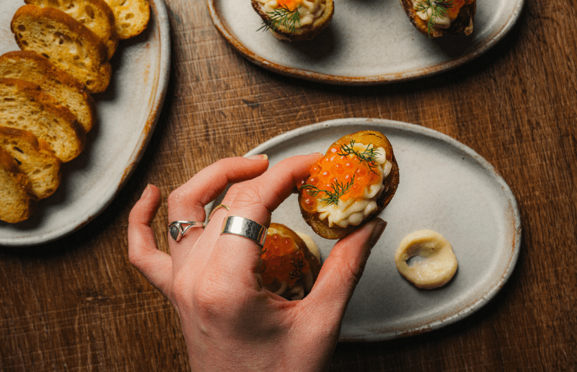 Image of hand holding the food at Teddy