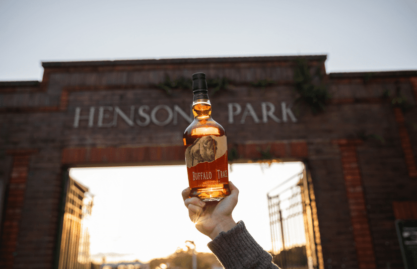 Image of Buffalo Trace bottle in front of Henson Park for Father's Day event with Buffalo Trace Whiskey
