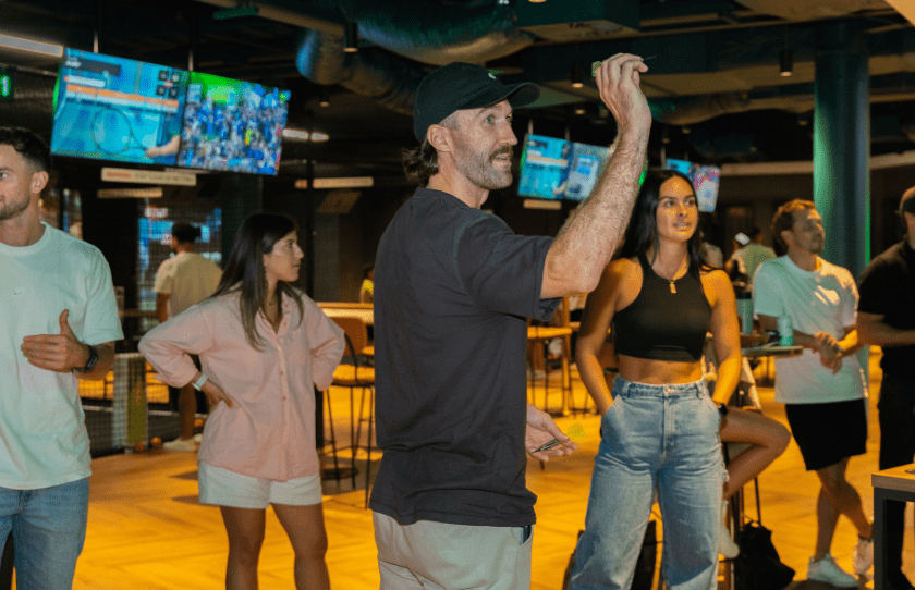 Sports Plus Immersive Experience - team sports - man about to shoot in darts