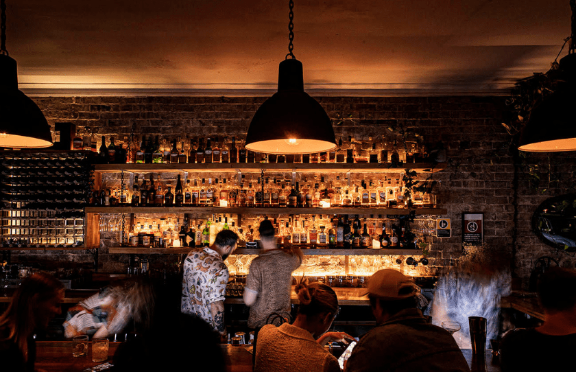 Neighbourhood Bondi Closing - image of the bar with people ordering drinks. 