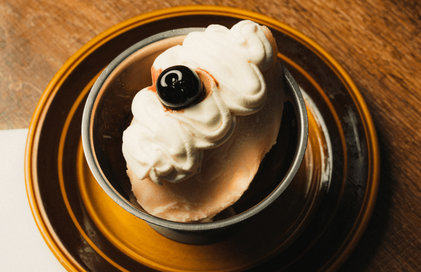 Teddy dessert in a bowl with a cherry on top