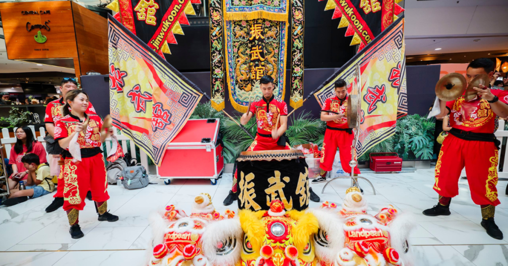 Moon Festival - acrobats with lion masks and chinese art, flags